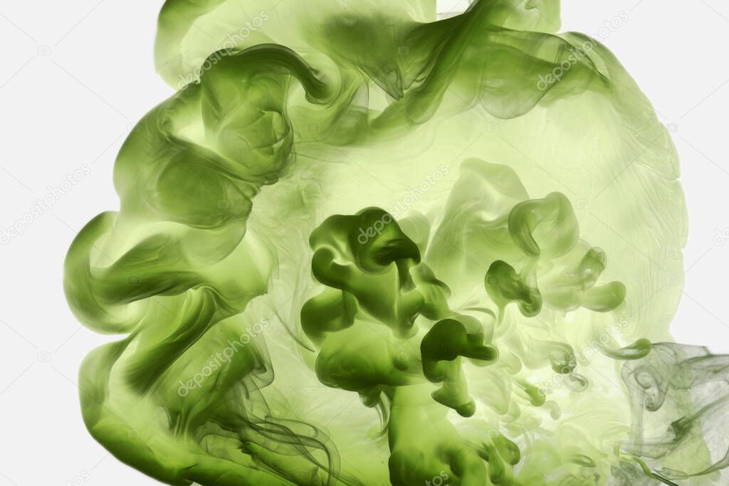 Green smoke abstract background, acrylic paint underwater explosion