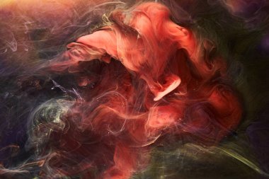 Çok renkli, koyu renkli, soyut bir arka plan, su altında akrilik boya patlaması.