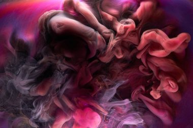 Çok renkli pembe duman soyut arka plan, su altında akrilik boya patlaması.