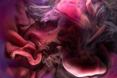Çok renkli pembe duman soyut arka plan, su altında akrilik boya patlaması.