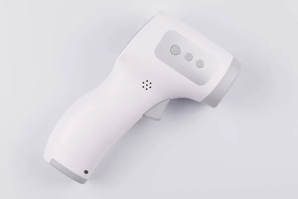 Temperature Measurement electronic Device. Isometric Digital Infrared Non-Contact Thermometer Gun isolated on white background. medical diagnostic and healthcare concept