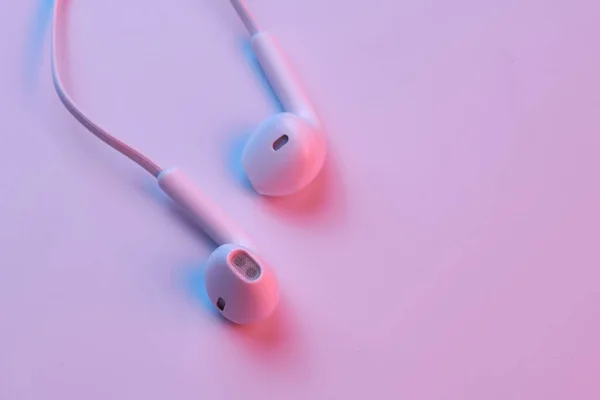 Wired White Earphones Isolated White Background Close Pink Neon Light — Stock Photo, Image