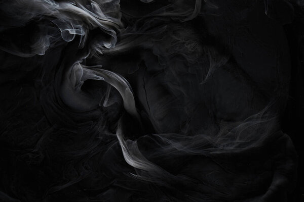 Black gray smoke abstract background, acrylic paint underwater explosion, swirling ink