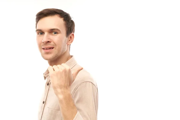 Portrait Friendly Positive Young Man Smiling Pointing Finger Empty Copy — Stock Photo, Image