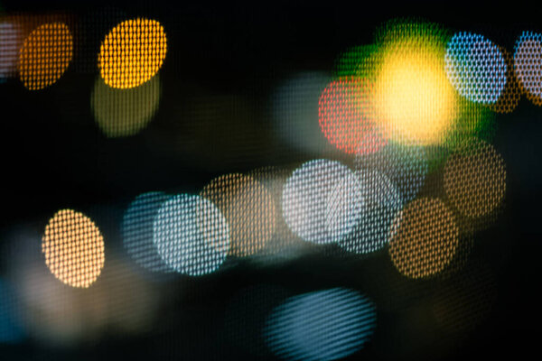 Bokeh on black. Abstract background.