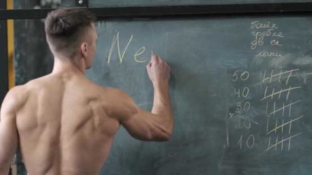 Muscular Athletic Man Writing Blackboard Chalk Sport Weight Lifting Health — Stock Video