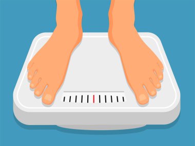 Woman is standing on bathroom scales, top view of feet. Weight measurement and control. Concept of healthy lifestyle, dieting and fitness