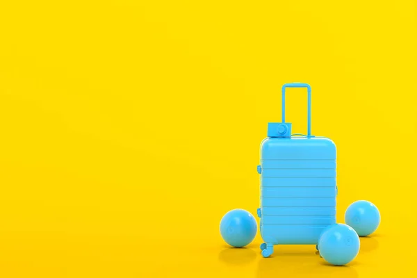 Bőrönd strandlabdával és papucs sárga alapon. — Stock Fotó