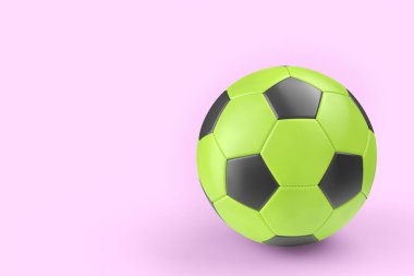 Yeşil futbol topu ya da pembe arka planda izole edilmiş futbol topu. Takım oyunu için 3 boyutlu spor aksesuarları hazırlama