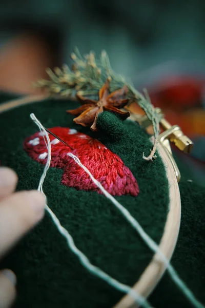 Embroidery process with cotton thread of mushrooms hat. — Stock Photo, Image