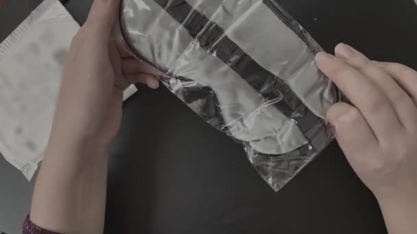 Female Hands Unpack Parcel Online Purchase Silk Fabric Sleep Mask — Stock video