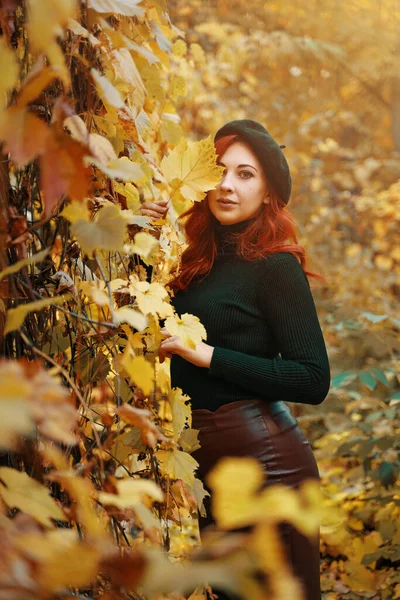 Cute Red Haired Woman Covers Eye Autumn Leaf Beautiful Girl — Stockfoto