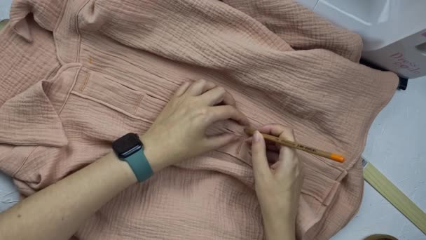 Needlewomans Hands Take Cotton Muslin Shirt White Work Table Puts — Vídeo de stock