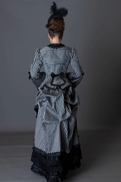 Victorian Woman Wearing Striped Silk Polonaise Black Skirt Hat Feathers — 图库照片