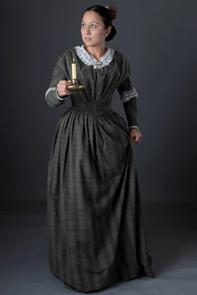 Victorian Working Class Woman Standing Alone Holding Candle Dark — Stockfoto