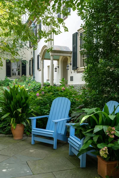 Blue Adirondack Chair Sitting Patio Mansion Background — стоковое фото