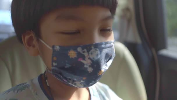 Asian Boy Traveling Car Wearing Protection Mask Protect Coronavirus While — Stock Video