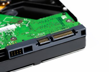 An internal Hardisk drive in 3.5 size isolated on white closed up on the SATA connection.