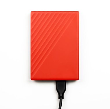 Orange External Hard drive isolated on white. top view.