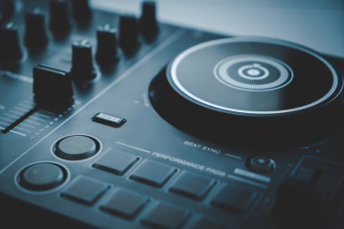 Digital DJ mixing deck Controller closed up on The turning Deck disc part.