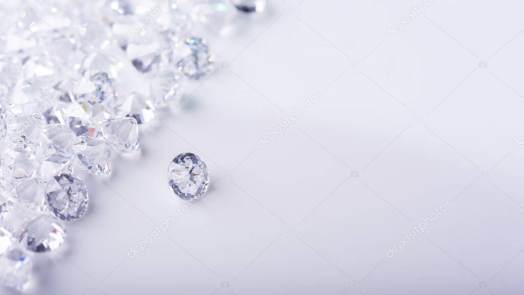 Diamond with tweezers and magnifier.reflections on the ground. brilliant cut diamond held by tweezers.Gemstone Beauty