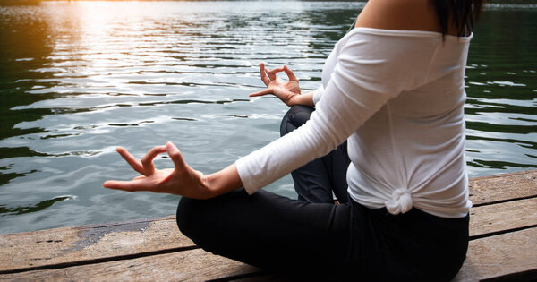 Yoga Young girl or people pose balance body vital zen meditation for workout nature mountain background in morning sunrise.Lifestyle woman yoga exercise and pose for healthy life. 