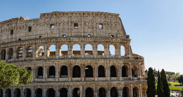Great Roman Colosseum, Coliseum, Colosseo, also known as the Flavian Amphitheatre. Famous world landmark. Scenic urban landscape. Rome, Italy. Europe