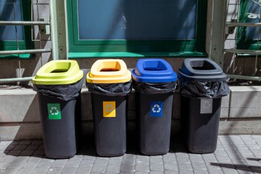 Colorful trash cans for sorting garbage. For plastic, glass, paper and others waste. Waste containers for garbage segregation in Poland