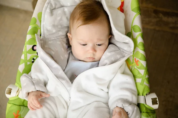 Close up portrait of pretty babe in baby carriage. — Stock Photo, Image