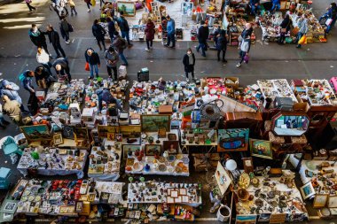 Barcelona (Catalonia, Spain) - January 8, 2022: Unidentified people choose a product among the stalls of Barcelona's most famous flea market, located in the Glories district.