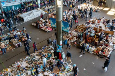 Barcelona (Catalonia, Spain) - January 8, 2022: Unidentified people choose a product among the stalls of Barcelona's most famous flea market, located in the Glories district.