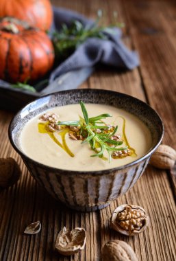 Delicious creamy pumpkin and walnut soup in a bowl