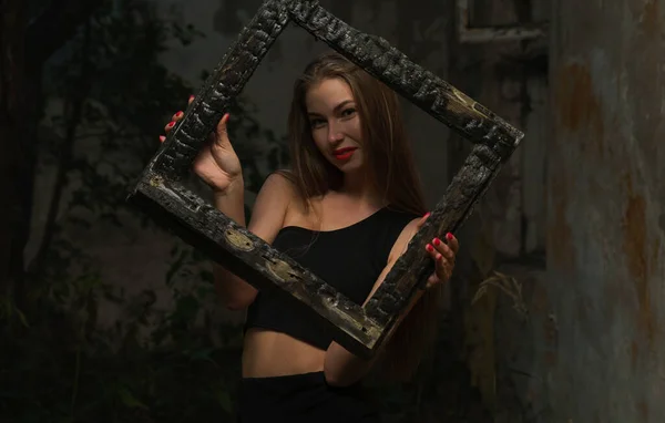 Young Woman Looking Burned Wooden Frame Dark — 스톡 사진