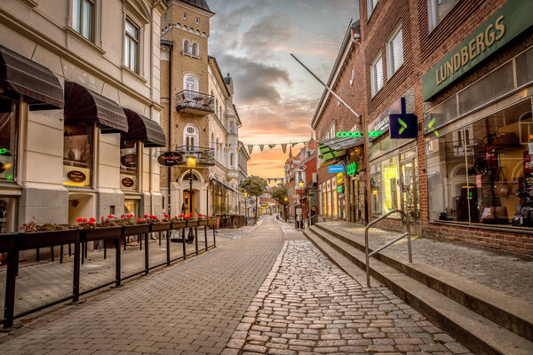 The shopping street in Ystad an early morning before the sunrise with all the lights on, Ystad, Sweden, September 14, 2021Ystad, Sweden, September 14, 2021
