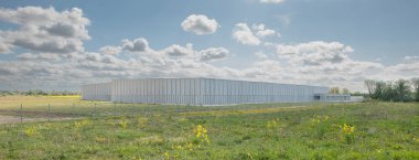 Storage building for the for the Royal Danish Library and National Museum in a green field at Vinge, Denmark, May 14, 2022
