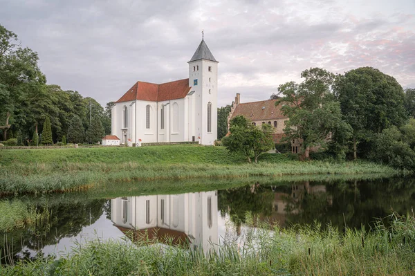 Rural Scene White Scandinavian Church Reflected Mirror Lake Sun Sets — Stockfoto