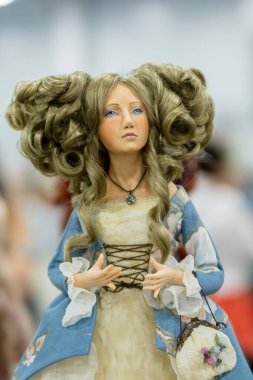 KIEV, Ukraine - September 06 ,2020: The doll looks like a real one. Girl with a magnificent hairstyle and a medieval dress.