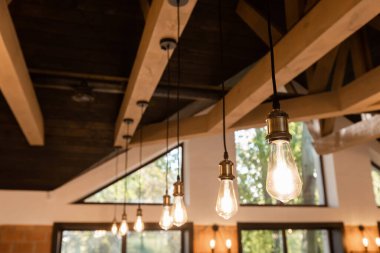 Retro light bulbs hanging in department store, with decorate interior luxury, fixtures combine beautiful modernity Designer, lamps on the ceiling