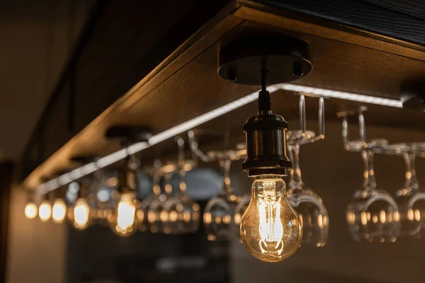 Retro light bulbs hanging in department store, with decorate interior luxury, fixtures combine beautiful modernity Designer, lamps on the ceiling
