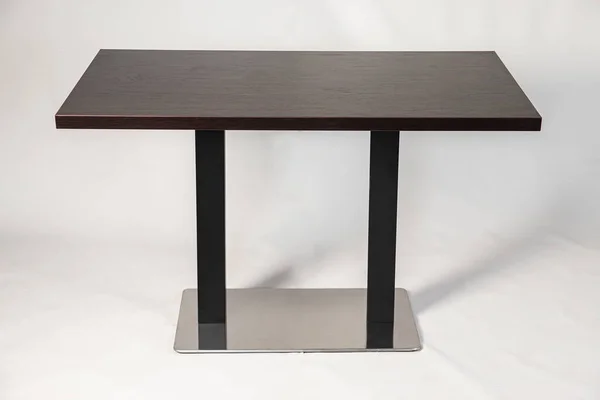 table with metallomit legs on a white background
