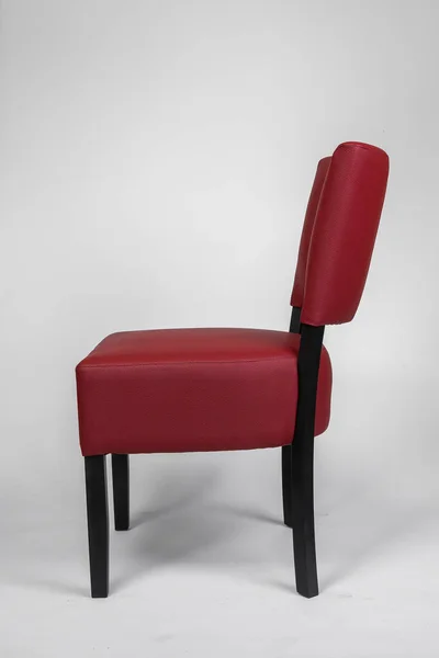 armchairs with a red leather seat
