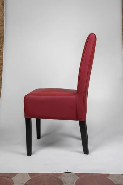 armchairs with a red leather seat