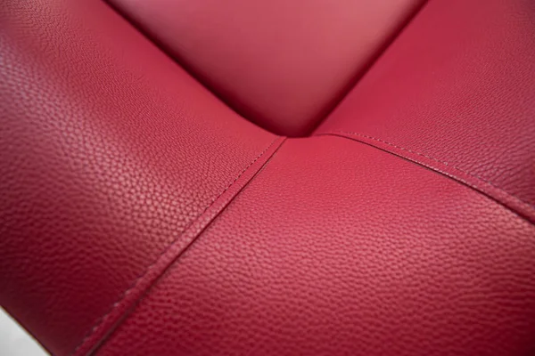 stock image armchairs with a red leather seat