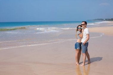 Portrait of lovely couple in love having fun on the beach. Young beautiful people hugging . Romantic moment. Valentine's day. Honey moon.