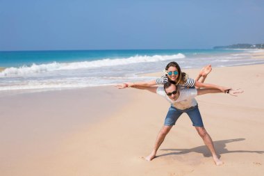 Portrait of lovely couple in love having fun on the beach. Young beautiful people hugging . Romantic moment. Valentine's day. Honey moon.