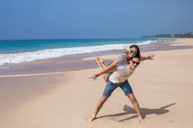 Portrait of lovely couple in love having fun on the beach. Young beautiful people hugging . Romantic moment. Valentine's day. Honey moon.