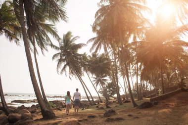 Portrait of lovely couple in love having fun on the beach. Young beautiful people hugging . Romantic moment. Valentine's day. Honey moon.