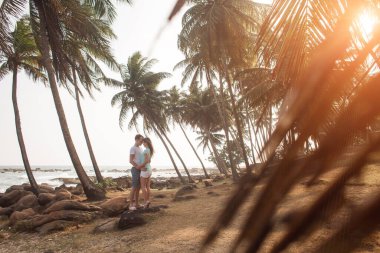 Portrait of lovely couple in love having fun on the beach. Young beautiful people hugging . Romantic moment. Valentine's day. Honey moon.