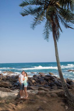 Portrait of lovely couple in love having fun on the beach. Young beautiful people hugging . Romantic moment. Valentine's day. Honey moon.