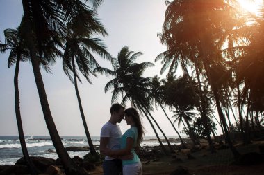 Portrait of lovely couple in love having fun on the beach. Young beautiful people hugging . Romantic moment. Valentine's day. Honey moon.